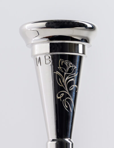 “A Single Rose” Mouthpiece Engraving Suitable for C Series, Myers models, heavy or lightweight trombone pieces and trumpet shanks. Cost is $20.