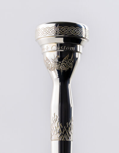 “Coil Wrap” Mouthpiece Engraving (This photo highlights the rim engravings.) Suitable for all trumpet, cornet, flugelhorn and trombone pieces. The cost is $100 for trumpet, $110.00 for trombones.